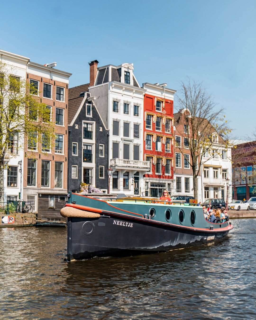 Where tugboats once pulled cargo, Neeltje now carries sunshine, friends, and Prosecco.
